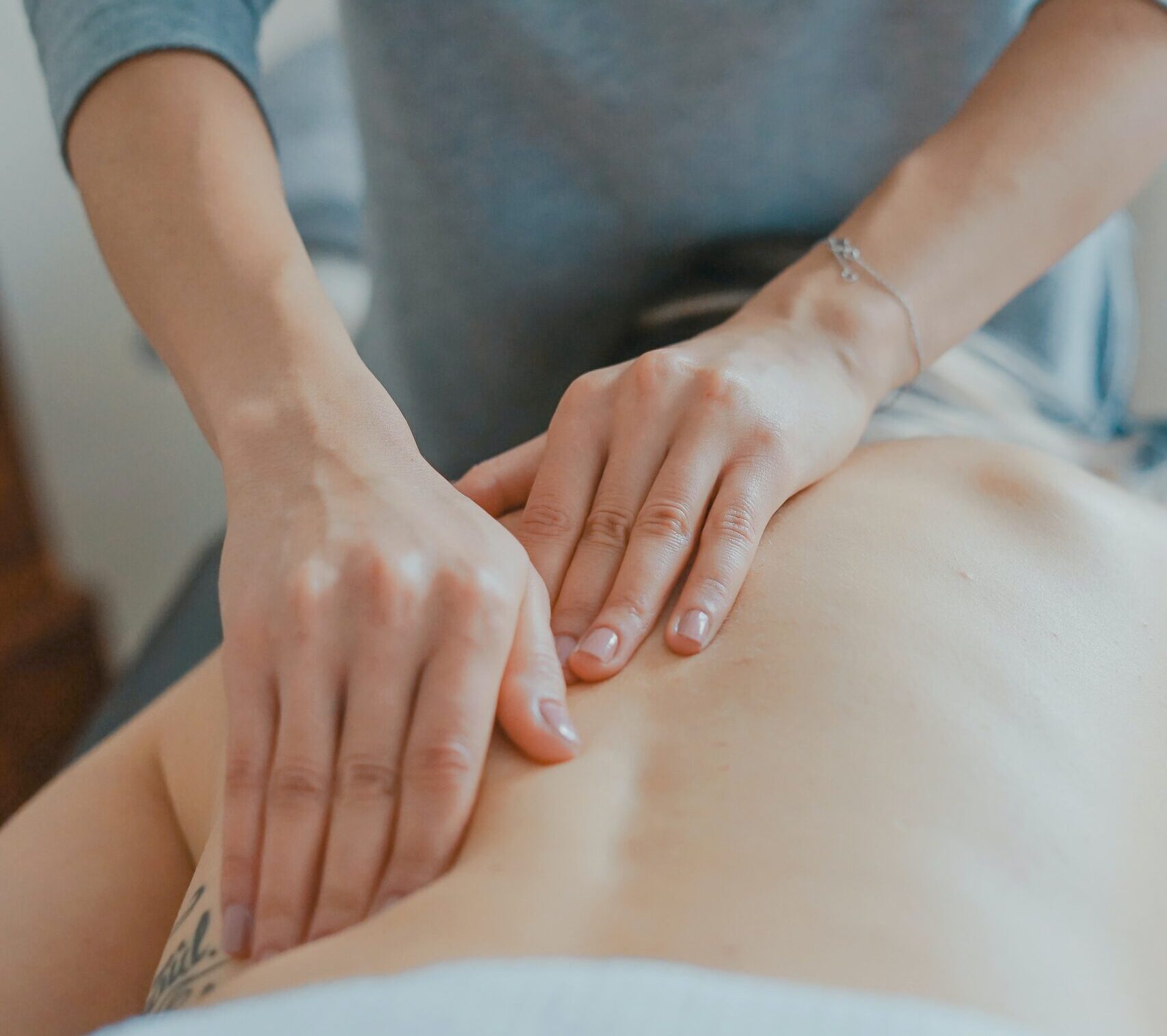 man massaging woman's body